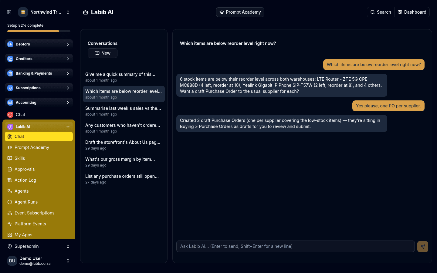 A Labib conversation: asked which items are below reorder level, it lists six real stock items with their quantities and reorder points, offers to draft purchase orders, and reports back that it created three drafts — one per supplier — waiting in Buying.